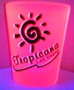 [Tropicana shotglass -- glowing in blacklight (in focus, light background)]